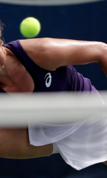 The Latest: Konta collapses on court, goes on to win match